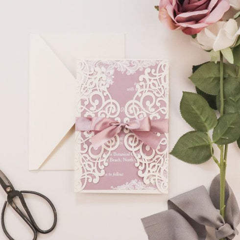 Dreamy Mauve Ivory laser cut lace invitation with background in mauve colors