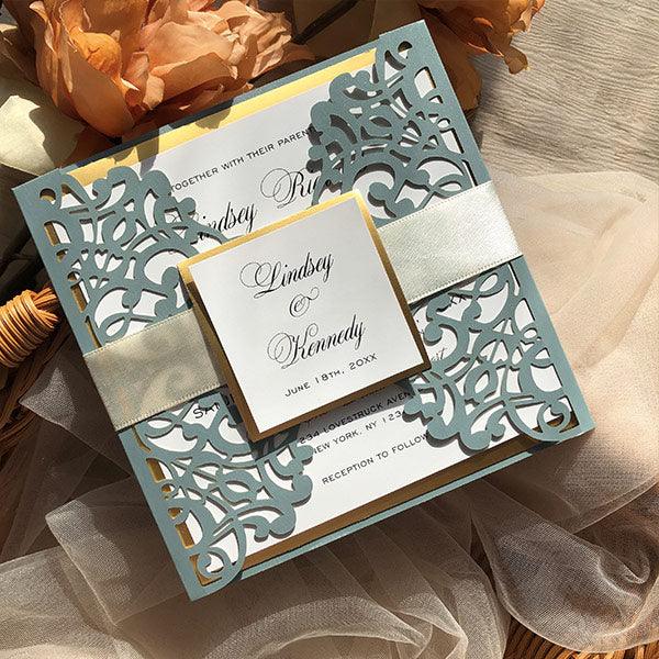 elegant dusty blue and ivory laser cut wedding invitations with gold liner CWIL85