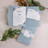 shades of dusty blue and silver pocket-fold wedding invitations CWIL99